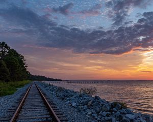 Preview wallpaper rails, railroad, coast, twilight