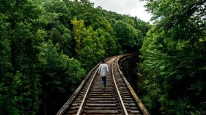 Preview wallpaper railway, man, walk, trees