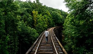Preview wallpaper railway, man, walk, trees