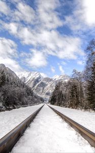 Preview wallpaper railway, mountains, snowy, distance