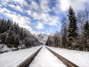 Preview wallpaper railway, mountains, snowy, distance