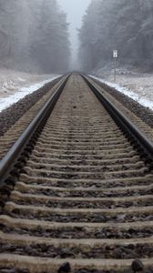 Preview wallpaper railway, rails, forest, snow, fog