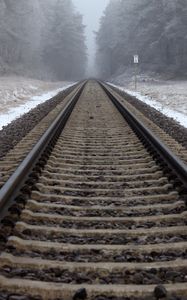 Preview wallpaper railway, rails, forest, snow, fog