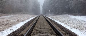 Preview wallpaper railway, rails, forest, snow, fog