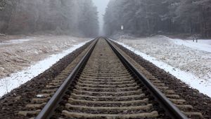 Preview wallpaper railway, rails, forest, snow, fog