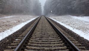 Preview wallpaper railway, rails, forest, snow, fog