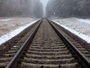 Preview wallpaper railway, rails, forest, snow, fog