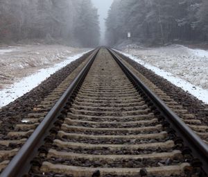 Preview wallpaper railway, rails, forest, snow, fog