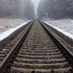 Preview wallpaper railway, rails, forest, snow, fog