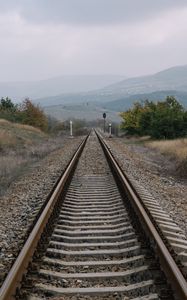 Preview wallpaper railway, rails, hills, fog