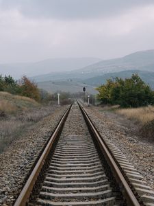 Preview wallpaper railway, rails, hills, fog