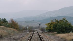 Preview wallpaper railway, rails, hills, fog