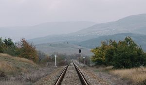 Preview wallpaper railway, rails, hills, fog