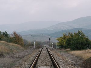 Preview wallpaper railway, rails, hills, fog