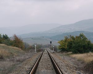 Preview wallpaper railway, rails, hills, fog