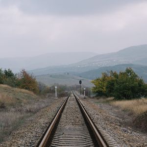 Preview wallpaper railway, rails, hills, fog