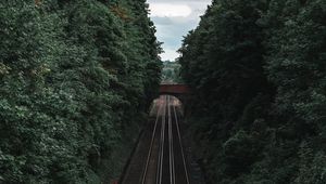 Preview wallpaper railway, rails, trees, tunnel, corridor