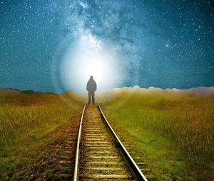 Preview wallpaper railway, silhouette, road, light, starry sky