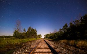Preview wallpaper railway, starry sky, direction, trees