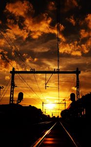 Preview wallpaper railway, sunset, clouds, station, wires, traffic lights