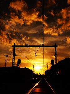 Preview wallpaper railway, sunset, clouds, station, wires, traffic lights