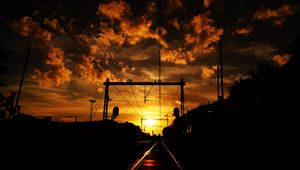 Preview wallpaper railway, sunset, clouds, station, wires, traffic lights