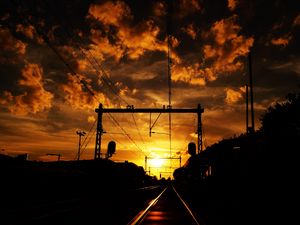 Preview wallpaper railway, sunset, clouds, station, wires, traffic lights