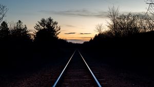 Preview wallpaper railway, trees, twilight, dark