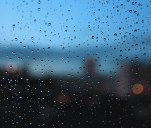 Preview wallpaper rain, glass, drops, wet, city, macro