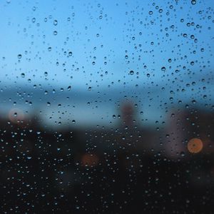 Preview wallpaper rain, glass, drops, wet, city, macro