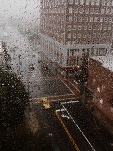 Preview wallpaper rain, glass, drops, city, wet, macro