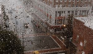 Preview wallpaper rain, glass, drops, city, wet, macro