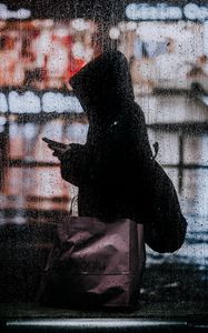 Preview wallpaper rain, silhouette, hood, drops