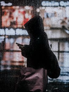 Preview wallpaper rain, silhouette, hood, drops