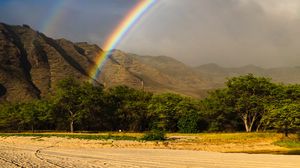 Preview wallpaper rainbow, beach, mountain, trees, sand