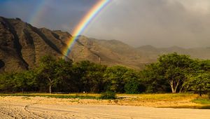 Preview wallpaper rainbow, beach, mountain, trees, sand