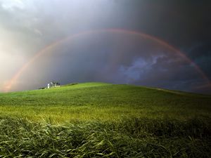 Preview wallpaper rainbow, field, meadow, hill, construction, cloudy