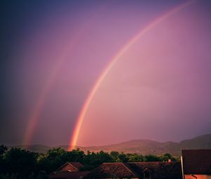 Preview wallpaper rainbow, sky, buildings, dusk