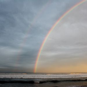 Preview wallpaper rainbow, sky, clouds, sea, shore, nature