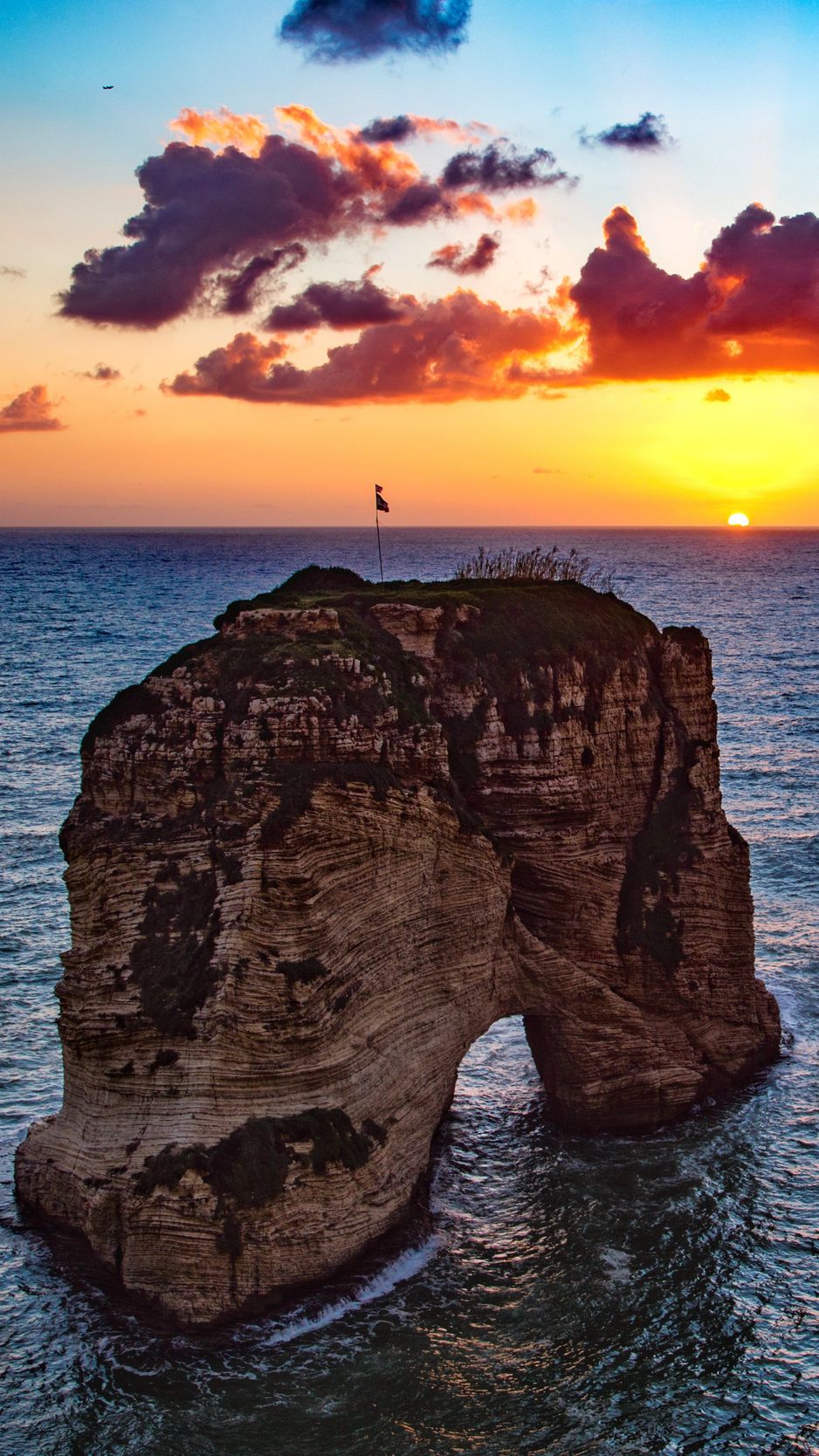 Download wallpaper 938x1668 raouche rocks, beirut, lebanon, sea, sunset  iphone 8/7/6s/6 for parallax hd background