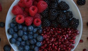 Preview wallpaper raspberries, blueberries, blackberries, pomegranate, berries, bowl