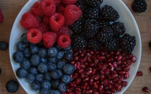 Preview wallpaper raspberries, blueberries, blackberries, pomegranate, berries, bowl