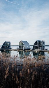 Preview wallpaper reeds, lake, pier, buildings