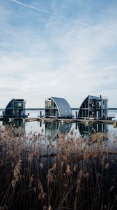 Preview wallpaper reeds, lake, pier, buildings