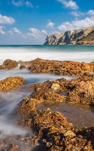 Preview wallpaper reefs, sea, mountains, long exposure