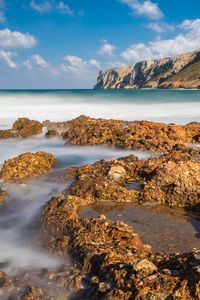 Preview wallpaper reefs, sea, mountains, long exposure