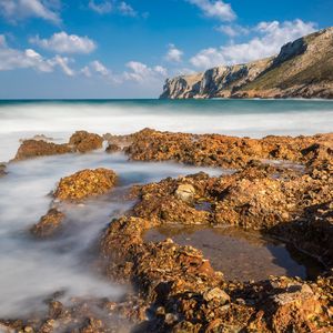 Preview wallpaper reefs, sea, mountains, long exposure