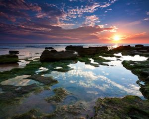 Preview wallpaper reeves, decline, sun, light, outflow, pools, rocks, stones, sea, coast, evening, silence, sky