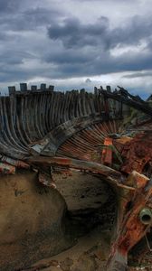 Preview wallpaper remains, boat, framework, stones, cloudy