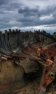 Preview wallpaper remains, boat, framework, stones, cloudy